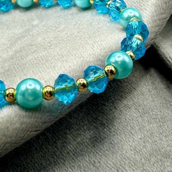 Blue glass pearl and bead bracelet.