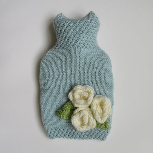 Duck egg blue hot water bottle cover with three cream roses.
