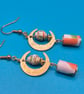 Green and orange Paper beaded earrings on a golden half moon finding