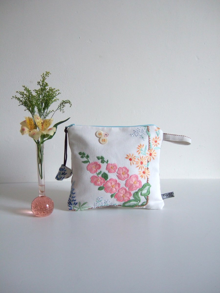 Craft sale Make up or cosmetics bag sewn from floral vintage table linen.