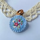 Crochet lace collar with blue embroidered wool felt pendant