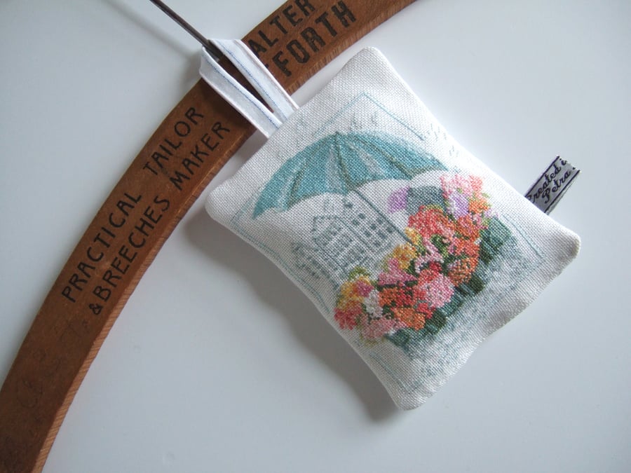   Lavender bag with vintage embroidery flower seller illustration.