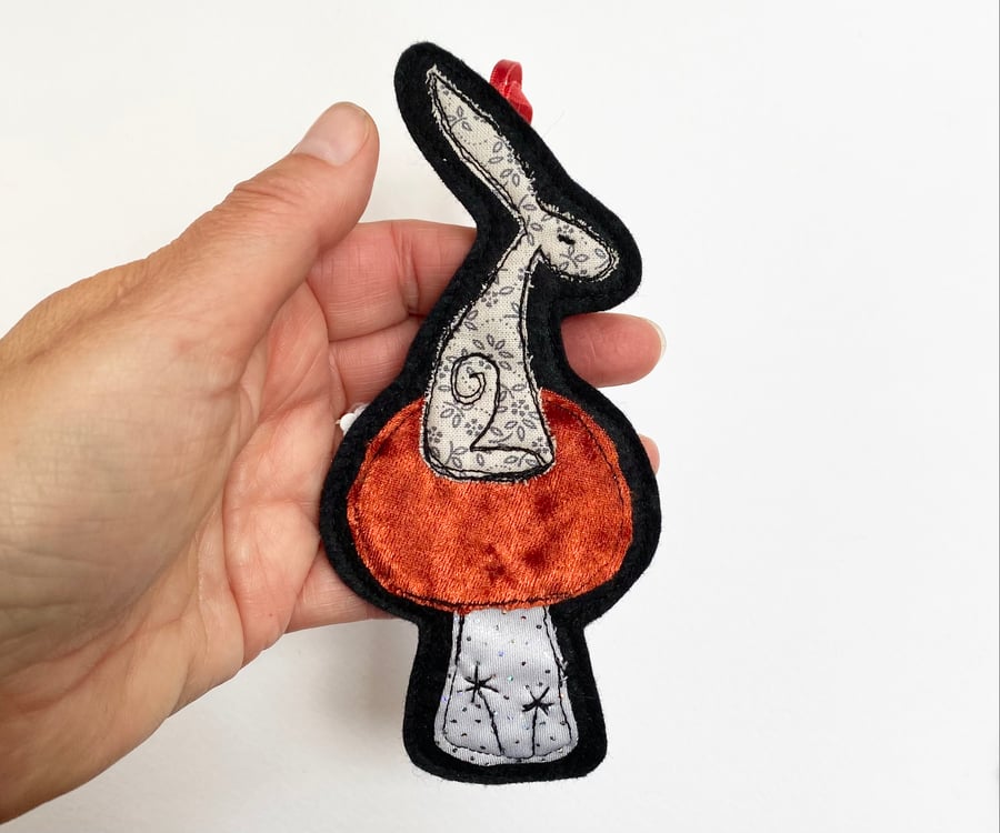 Upcycled embroidered hare home decoration. 