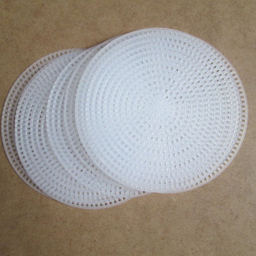 SOLD - Eight Plastic Canvas Discs 11 cm diameter