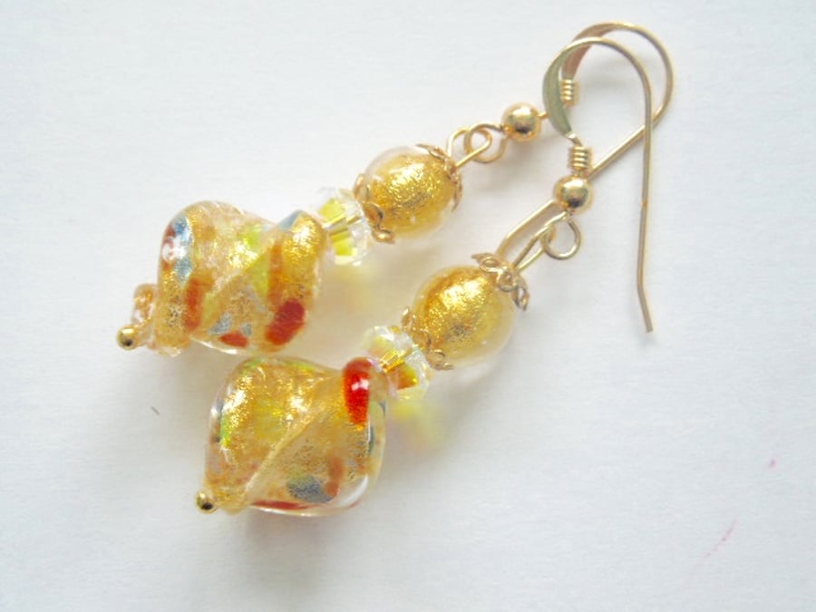 Murano glass gold twist earrings with Swarovski crystal and gold fill wires.