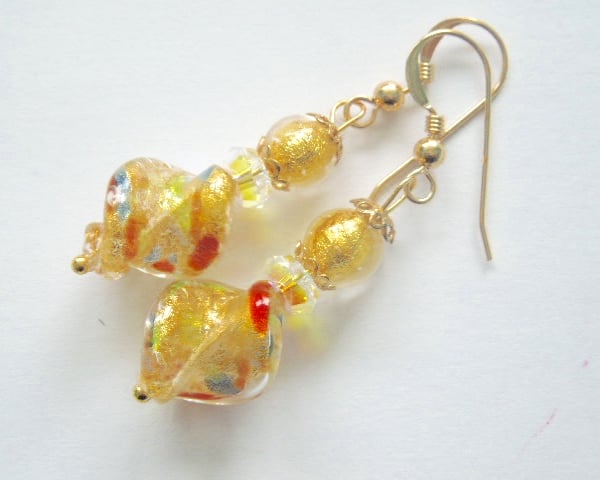 Murano glass gold twist earrings with Swarovski crystal and gold fill wires.