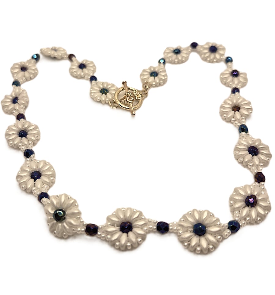 White daisy chain necklace with dyed haematite beads