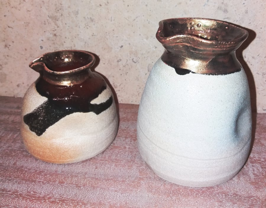 Tactile ceramic pinched jugs