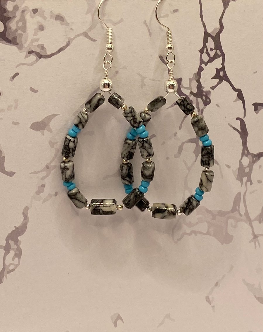 Wire teardrop earrings with pinolith stone tubes 