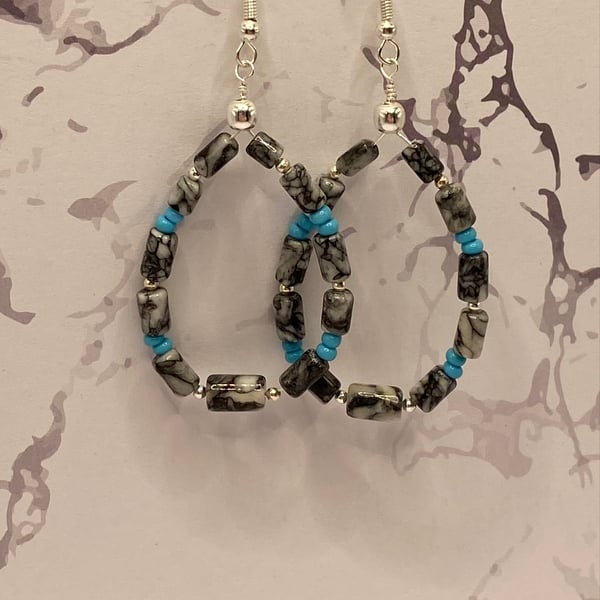 Wire teardrop earrings with pinolith stone tubes 