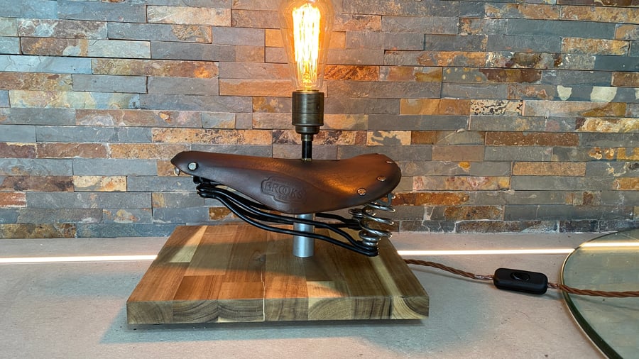 Up cycled Vintage Brooks Leather saddle into a unique table lamp