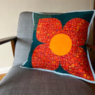 Large single flower on a square quilted cushion