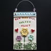 Ceramic How does your garden grow? wall plaque folksygardeners
