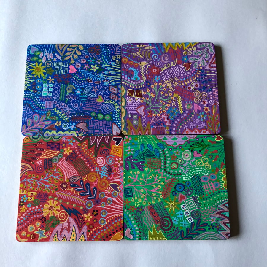4 colourful hand painted wooden coasters 
