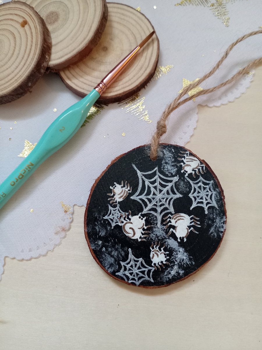 White spiders hanging wood slice decoration 