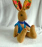 Lupin, a 16" fleece unjointed rabbit with neckerchief and knitted waistcoat. - Image 7