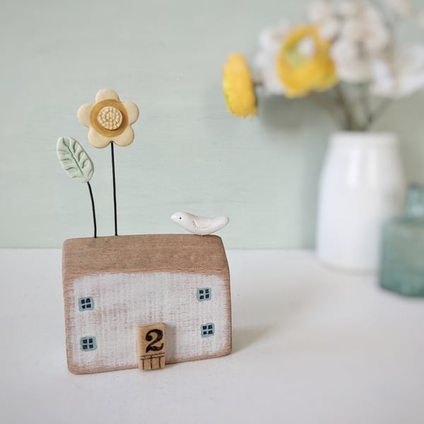 Little Wooden House with Clay Flower and Bird