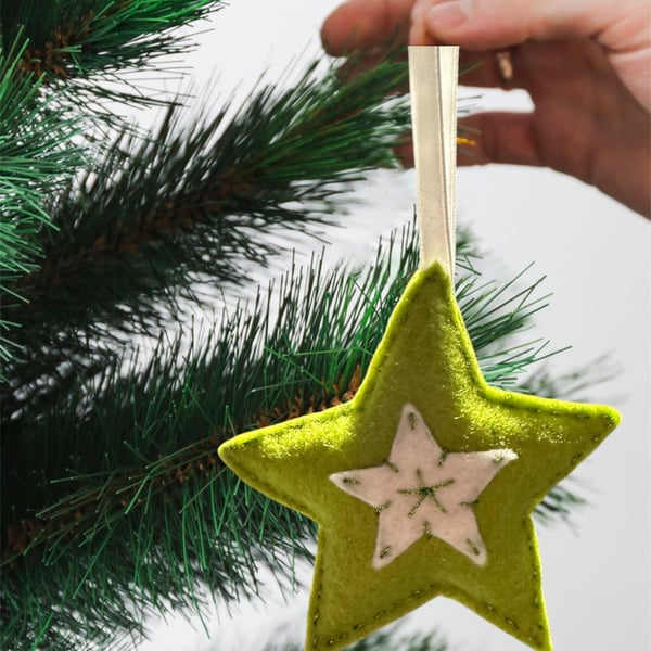 A star tree decoration, lime green and white with shiny metallic thread