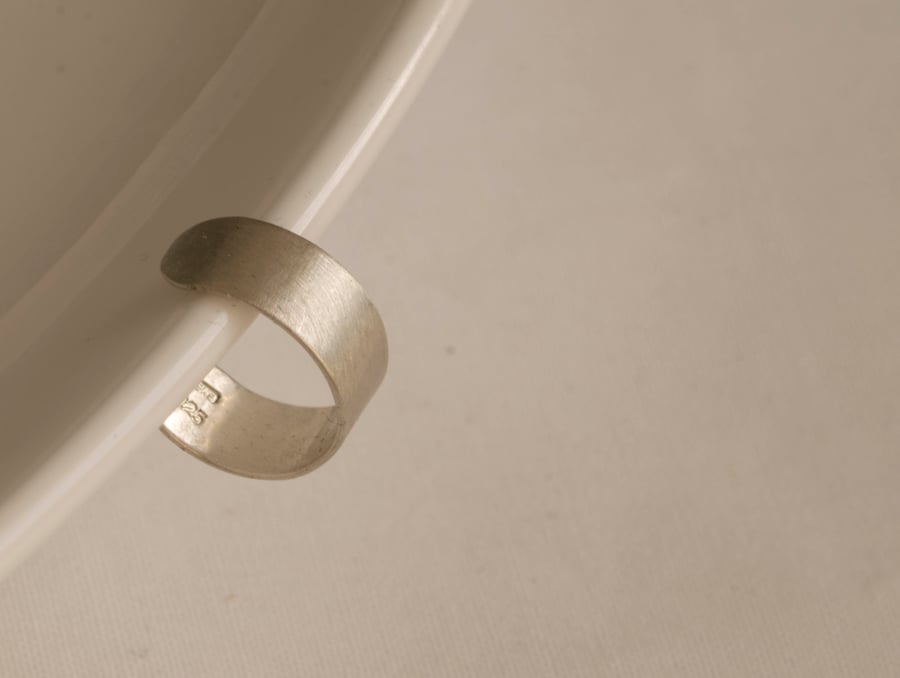 Slim silver ear cuff with a brush matte texture