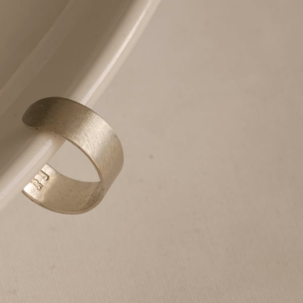 Slim silver ear cuff with a brush matte texture