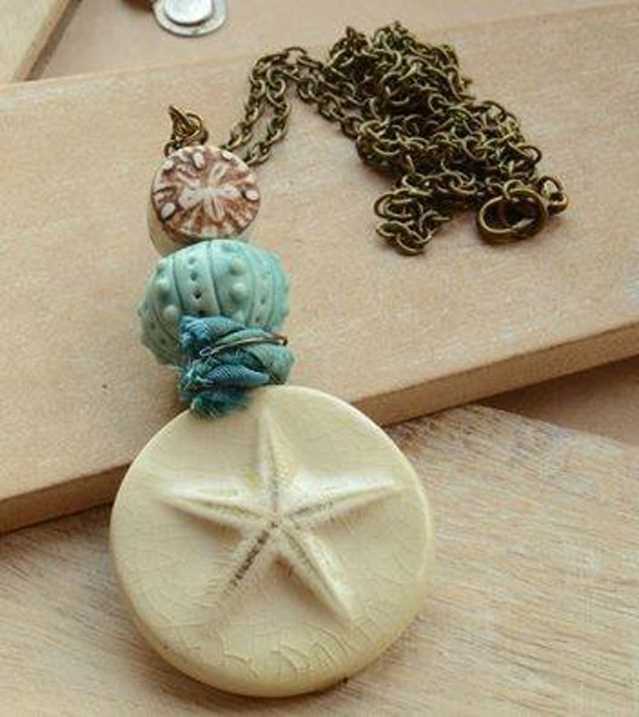 Cream Ceramic Starfish, Blue Urchin & Clay Bead Necklace