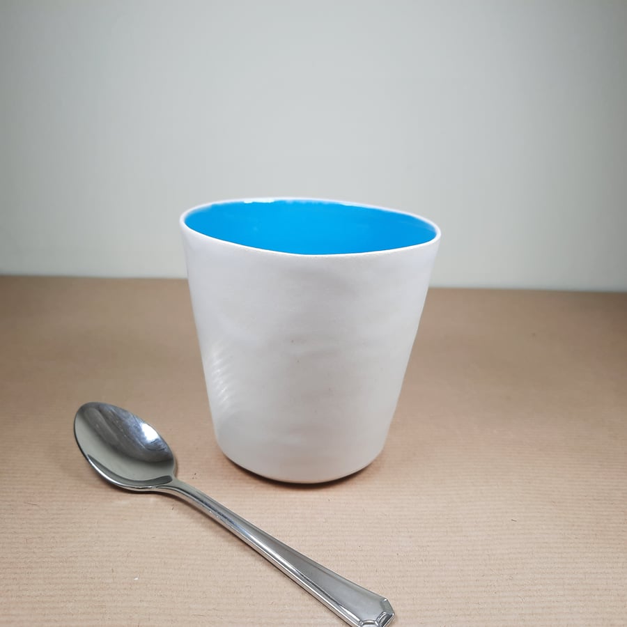 Handleless turquoise stoneware ceramic tumbler mug