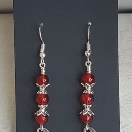 Vampire Bat Earrings - Silver tones and red beads.