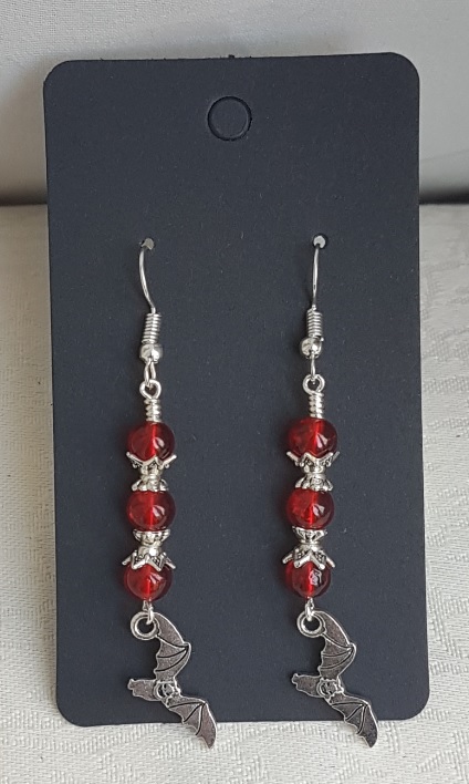 Vampire Bat Earrings - Silver tones and red beads.