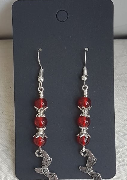 Vampire Bat Earrings - Silver tones and red beads.