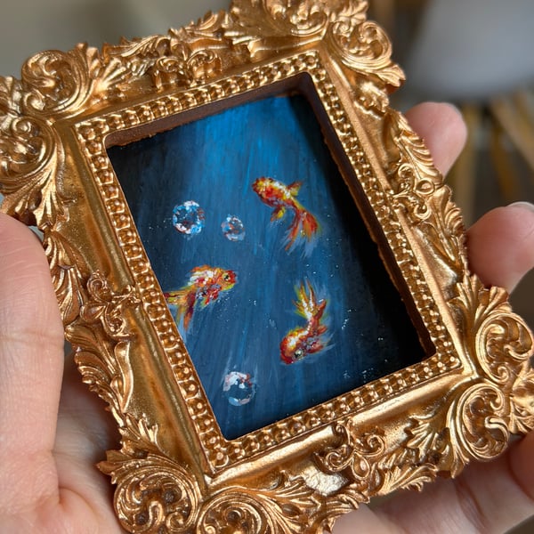 Moonlit goldfish painting in gold frame