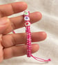 Children's Pink Macramé Bracelet with Colourful Flower Beads – Adjustable - Image 3