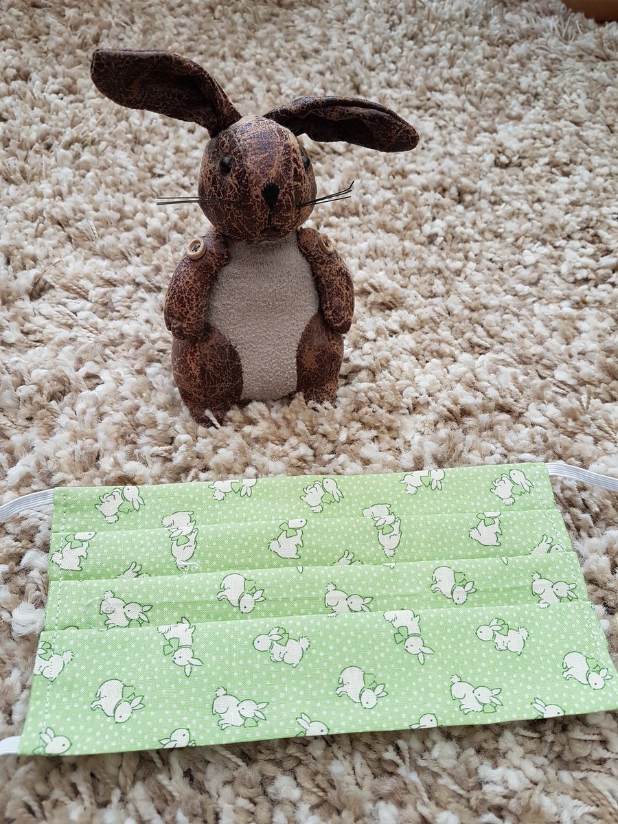Adult face covering – pale green rabbit print material