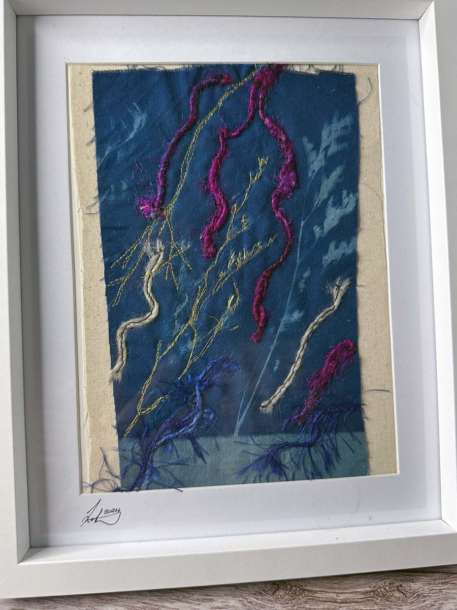 Hand-embroidered and free-motion stitched cyanotype artwork