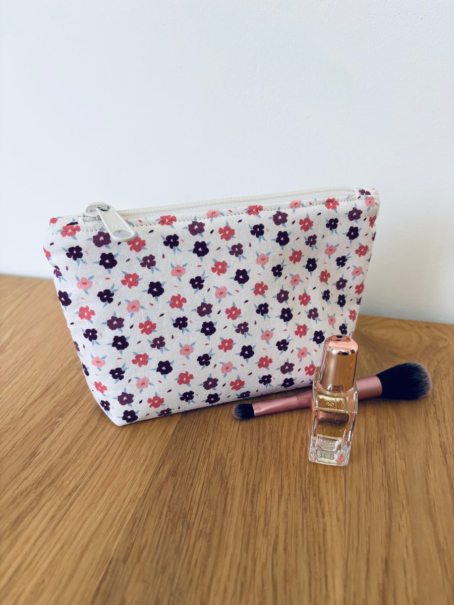Small cotton makeup bag, pouch, purse, in purple, pink & cream floral design.