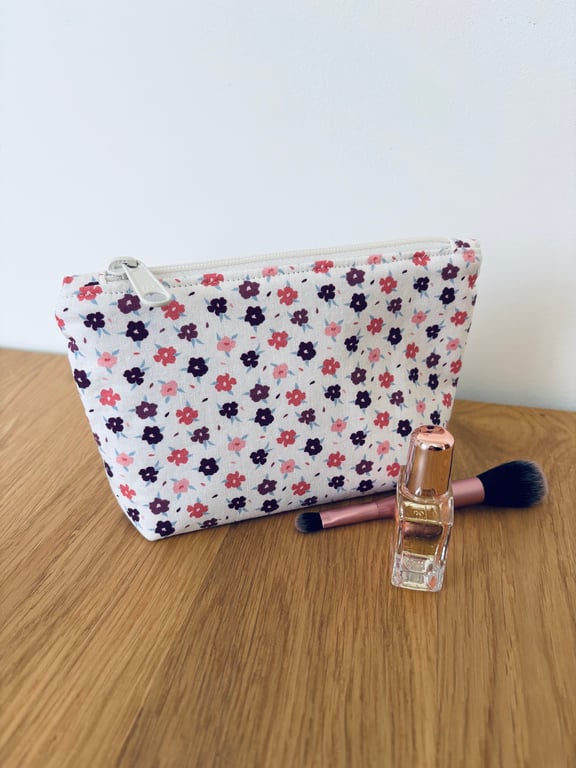 Small cotton makeup bag, pouch, purse, in purple, pink & cream floral design.