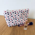 Small cotton makeup bag, pouch, purse, in purple, pink & cream floral design.
