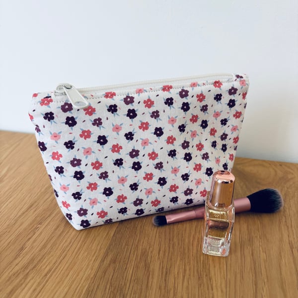 Small cotton makeup bag, pouch, purse, in purple, pink & cream floral design.