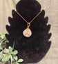 Beautiful wire wrapped grey pebble pendant on gold coloured chain. 