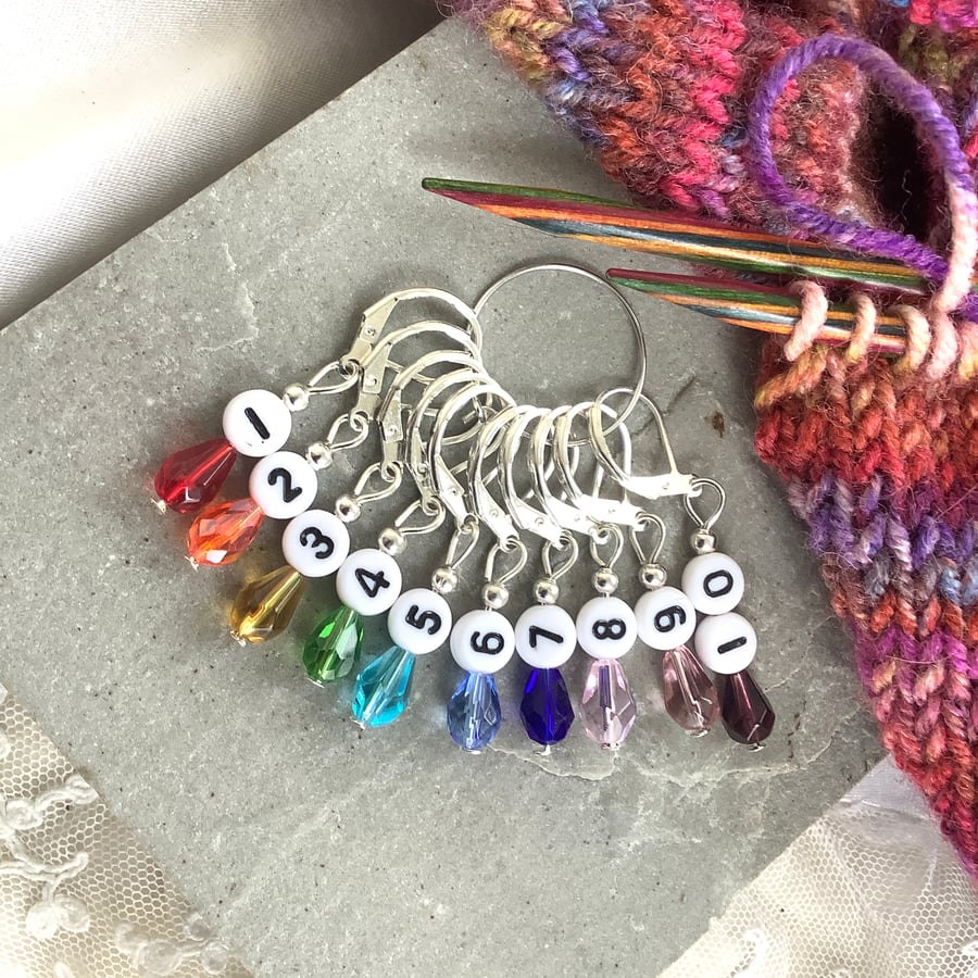 Numbered knitting or crochet stitch markers, rainbow crystal beads. 