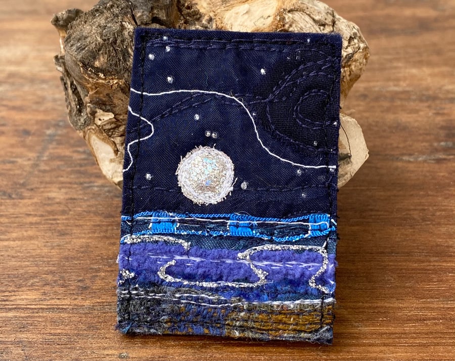 Embroidered up-cycled full moon seascape brooch pin or badge. 