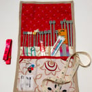 Knitting needle roll with needles and accessories