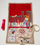Knitting needle roll with needles and accessories - Image 1