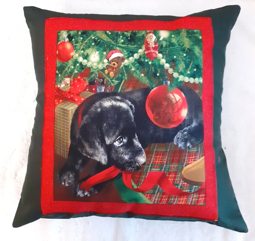 Black Labrador Puppy under Christmas tree cushion