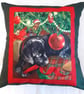 Black Labrador Puppy under Christmas tree cushion - Image 1