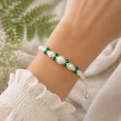 White macrame faux pearls and green glass beaded bracelet one size