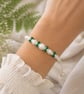 White macrame faux pearls and green glass beaded bracelet one size