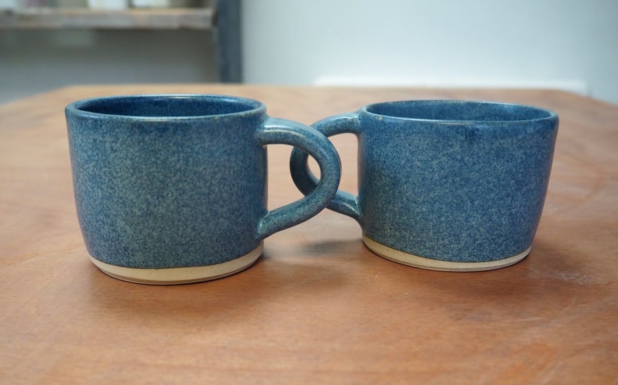 Set of two pottery mugs with a denim blue glaze