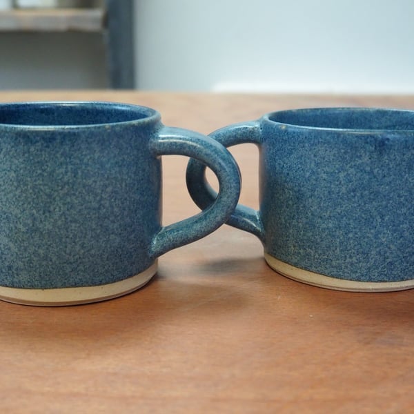 Set of two pottery mugs with a denim blue glaze