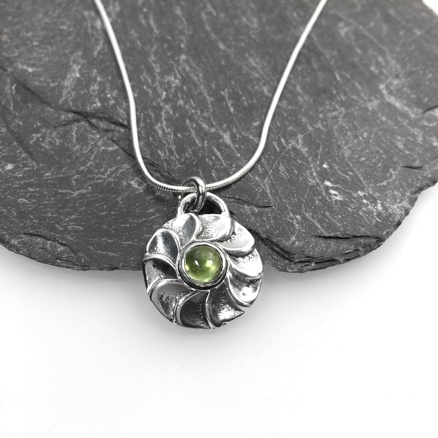 Sterling silver and green peridot flower pendant on silver chain