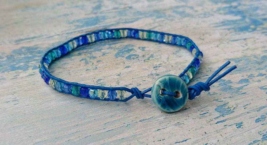 Blue leather bracelet with faceted glass bead mix and ceramic button